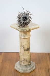 As Sheila tells it, her artistic journey with birds began at her childhood home in Missouri. "Outside a large picture window in the kitchen was a small porch. Above the porch were two planters. My mother and father would sit in the kitchen and look out. I came to plant one spring in 2007. As I removed the first planter, I saw five blue robin eggs. I carefully put it back and told my mom that she would have baby birds soon. I then took down the other planter where there was an empty nest. I took the nest home. My mother, with great tenderness, watched the birds and would call me with daily updates on the eggs. In the meantime, I placed the humble, fragile, empty nest on an ornate marble pedestal in the center of my studio."