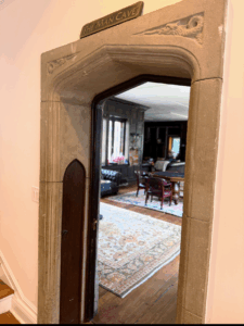 The carved stone arch marked “The Man Cave,” is the doorway to a wood-paneled study and where the estate sale hunt begins...