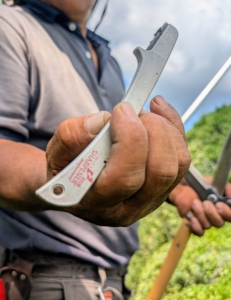 He uses a simple blade sharpener that removes dirt and restores the cutting edge. It is important to sharpen both blades especially if the shears have two cutting edges.