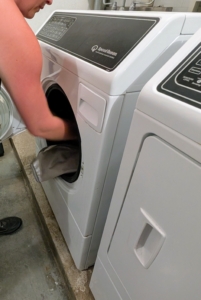 Another good laundry room tip is to make sure the doors of the washer and dryer don't block each other. Be sure to install front loading machine door hinges on the most convenient sides. This washer opens out to the left while the dryer swings open to the right. Doors are not in the way when unloading and loading.