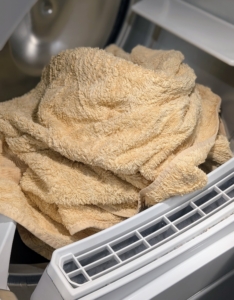Once the load is complete, Elvira places it in the dryer and selects her settings. Most dryers have settings that allow one to choose how dry the items would be. The permanent press setting has a cool-down cycle at the end to reduce wrinkling. On air fluff, the dryer circulates air but adds no heat. Bath towels should be dried completely.