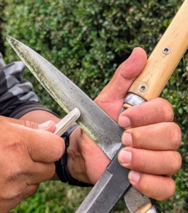 Occasionally, Phurba stops to sharpen his shears. I always impress upon the crew to take good care of the equipment and tools.