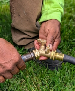 Use garden hoses splitters, available at garden centers, to connect multiple hoses to a single water source.