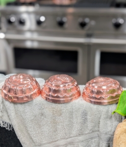 And here are three all washed and ready for drying and buffing. Jello, or jelly, molds became popular during the Victorian era when cooks experimented with recipes such as meat-based aspic. Copper molds, as opposed to the more affordable tin alternatives, were a sign of wealth. And by the 1950s and 1960s, these pieces were used for other recipes, especially those well-loved jelly creations.