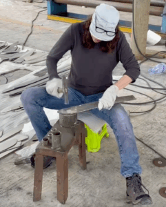 Sheila went on to create larger birds out of stainless steel. Here she is hammering feathers for a 10-foot piece.