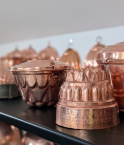 The copper looks so pretty gleaming on the shelves. Another tip: if you like the way your displays are arranged, take a quick snapshot before you remove them, so you know exactly how they should be returned.