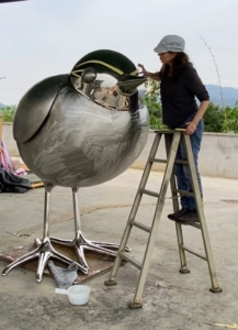 And here is Sheila working on the mask of her meadowlark sculpture she calls 'Superhero.'