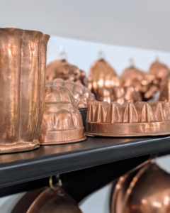Here is a shelf of copper molds and other containers in my studio kitchen. A couple times a year, I try to polish all the precious metals in my home including this copper. Copper was actually one of the first metals used by humans more than 10-thousand years ago, and it remains a common household material today.