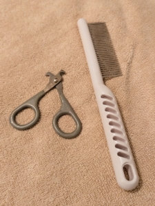 For daily grooming, I use a multipurpose comb for the cats because it is so light and easy to use, gets out tangles and dander, and makes grooming so quick. I also have a cat nail clipper on hand in case any nails need trimming.