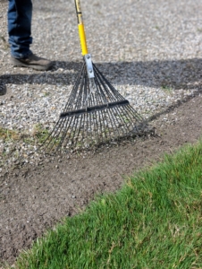 Fernando uses a soft rake to gather all the debris into one place.