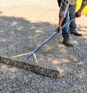 He uses the straight edge to move and level. These landscape rakes are easy to find at home improvement shops and some gardening centers.