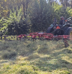 Fernando must drive through the field, carefully watching that he has flipped everything that was cut.