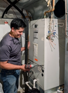 Hermes, who has been with the company for many years, opens the system's air handler.