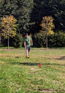 Here's Ryan measuring the area multiple times to ensure the placement of the trees is accurate. The trees will be perpendicular to the lindens seen behind him.