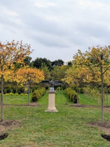 This view from the center shows the eagle atop its pedestal surrounded by the newly planted lindens. I think it looks excellent. I am so pleased with how well my maze is turning out. What do you think?