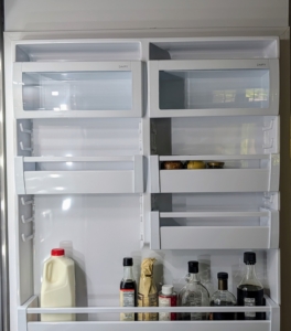 The door is outfitted with metal bins to securely hold all necessary items.
