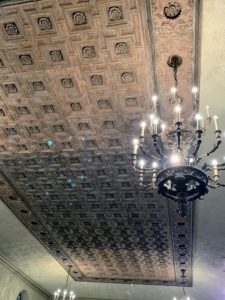 This 16th century coffered ceiling is from a palace in southern Italy, carved in a design of squares and crosses with rosettes in the center.