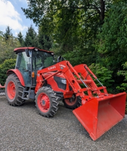 This M4-071 is larger tractor with an enclosed operator's cab. It's powered by a 73.2 HP diesel engine and has a rear lift capacity of more than three thousand pounds.