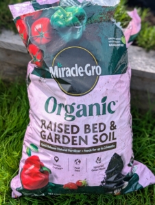 I use Miracle-Gro Raised Bed & Garden Soil, which is filled with slow release fertilizers that provide a steady supply of nitrogen, phosphorus, and potassium, essential for fruiting.