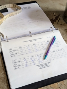 There is a page specifically meant to record TPR, which is done once a month for every horse, pony, and donkey. It is important to do this regularly to determine what is normal. At the bottom of this page, Helen indicates the normal ranges for horses.
