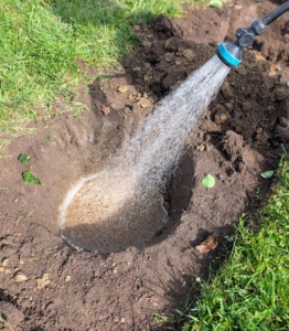 Once again, Chhiring fills the hole with water.