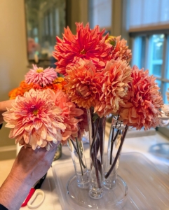 Then she follows up with other blooms to fill surrounding spaces. Dahlia stems are hollow, so they absorb water quickly through the outer layers.