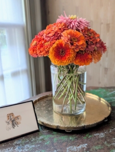 The zinnia arrangement was placed on a table in my sitting room.