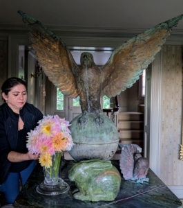 Here is Enma placing dahlias on my entrance hall table under the wing of my falcon.