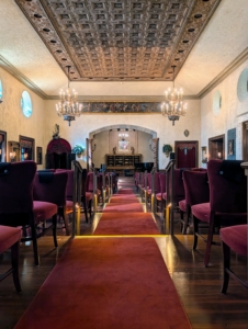 This is the Music Room at Caramoor. This room seats 170 guests and is known for its Renaissance furniture, Gothic tapestries, and stained glass elements.