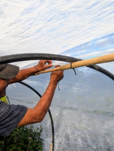 He also attaches it to the top bamboo cane, which will prevent it from blowing away.