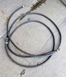 Using old unused hose sections and hose connectors at both ends, Pete created the perfect tie support for the plants. The rubber hose does not damage the trunks of the trees at all. Recycling and repurposing otherwise unusable hoses... it's a good thing.