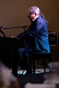 Here, Tim performs at the Oklahoma Music Hall of Fame in Muskogee, Oklahoma.