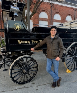 Here's Juan in front of the Whispery Pines carriage.
