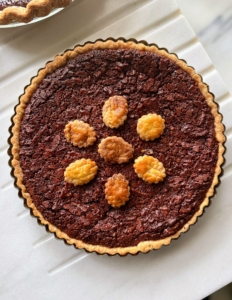 Here's a chocolate pecan tart.