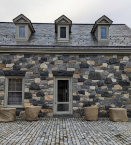 After a group is all done, they look like pieces of burlap art. Here is the front of the stable office – the urns and birdbaths look so neat and tidy.