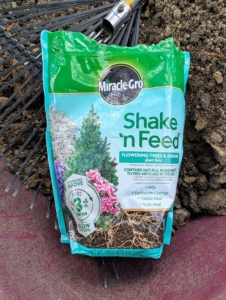 I use Miracle-Grow Shake 'n Feed for trees. This feeds the tree above and below the soil for three months.