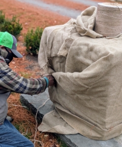 And then like a present, Pete tucks the fabric and pulls it snug before sewing the ends together.