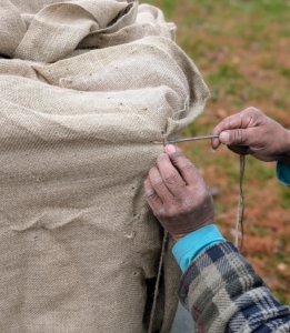 Because these containers will be exposed to winter elements for several months, Pete makes sure to do the task very carefully.