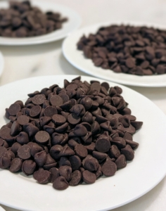 Semi sweet chocolates are measured and laid out for the chocolate pecan tarts.