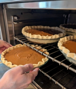 These maple bourbon pumpkin pies will bake for about 45-minutes to an hour until the custard is firm and the top is glossy and golden brown. Unfortunately, I had to leave while the pies were still baking.