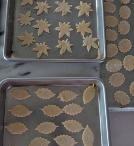 I also make lots of small decorations for the pies. The decorations are cut from the scraps of dough and baked separately.