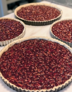These are the chocolate pecan tarts also ready to go into the oven - every member of the staff is required to bring the pie plate back after enjoying their dessert.