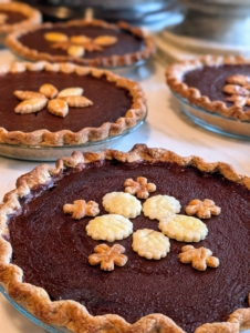 After they are all done and slightly cooled, the pies are packed in boxes and brought outside for "pick up."