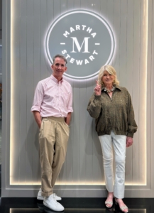 And here I am with our own Chief Creative Officer, Kevin Sharkey, in front of one of my retail stores. I am so proud to celebrate their openings - and I can't wait to open the next one!
