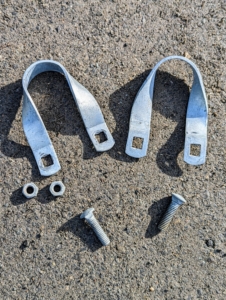 Holding the center piece in place are these tension purlin brackets. They connect the center piping to the bow sections.