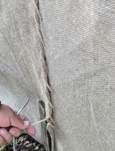 Phurba sews an opening closed and snug.