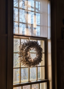 Indoors I always hang wreaths on every window. Do you know… before the wreath became associated with Christmas, it was used as a token of victory and power in ancient Greece and Rome? Wreaths first appeared as holiday decorations in connection with Yule, which marked the winter solstice for early Germanic Pagans. The wreaths were a symbol of spring and a promise of its return.