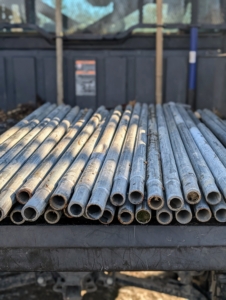 A few years ago, I came up with the idea to also use them for the burlap framing. In all, hundreds of ground stakes, purlin pipes, connectors, nuts, and bolts are used for the project.