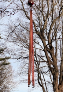 This crane sling is used to tie around the top of the section to be cut. The sling is designed to handle the full weight of the log until it is safely lowered to the ground.
