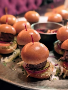Here's a tray of hamburger sliders on mini brioche buns - always a big hit with hungry crowds.